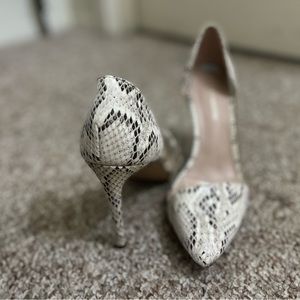 Snack skin and clear pointed heels.